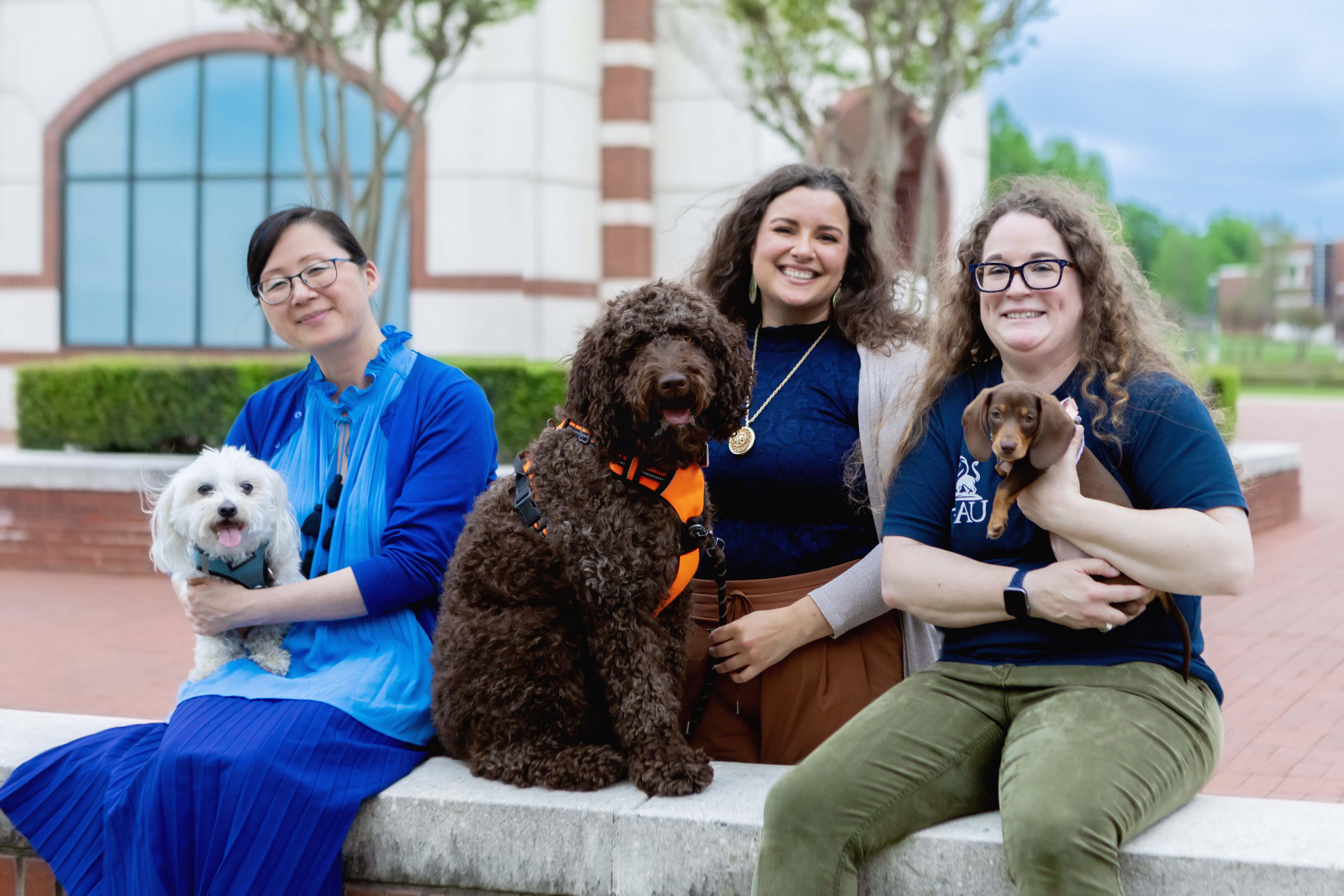 UAFS professors and puppies pose ahead of the UAFS Boreham Library's long night against procrastination event